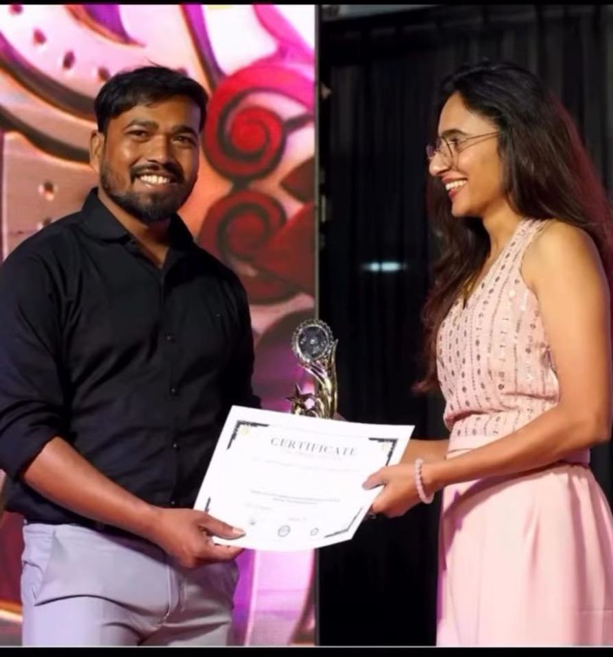 Receiving an award certificate on stage