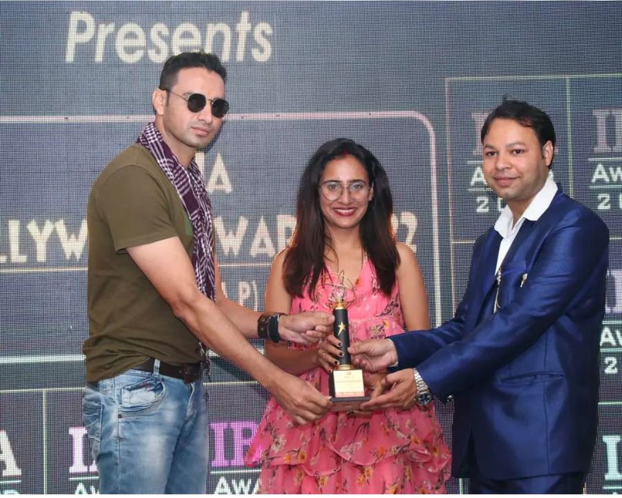 Receiving a designer award trophy