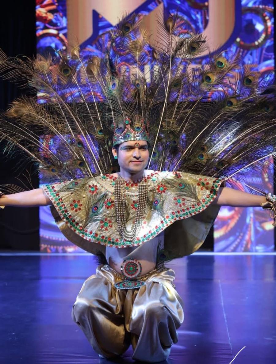 National costume design — peacock cape and gold dhoti on stage