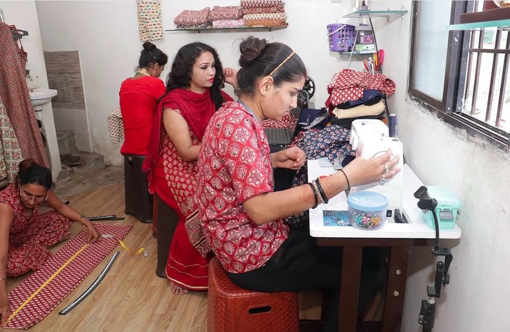 Students working at sewing machines in the studio